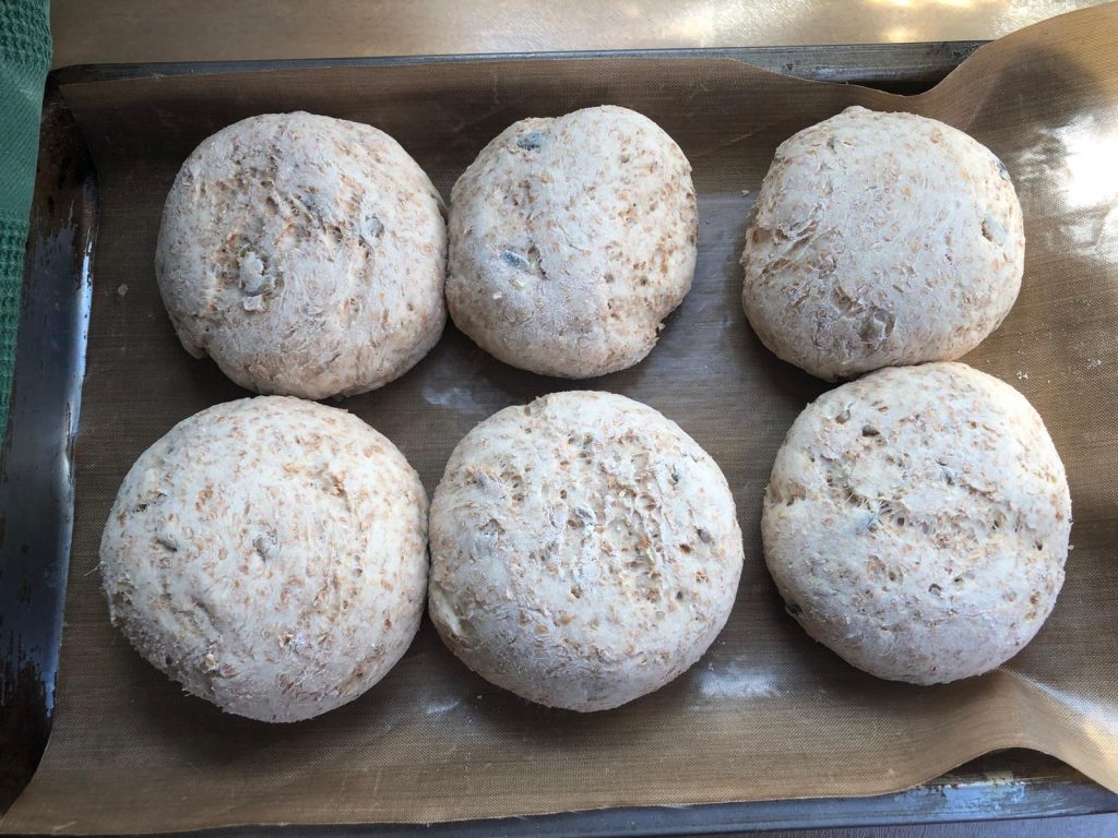 Photo of brown rolls after proving, before they go in the oven.